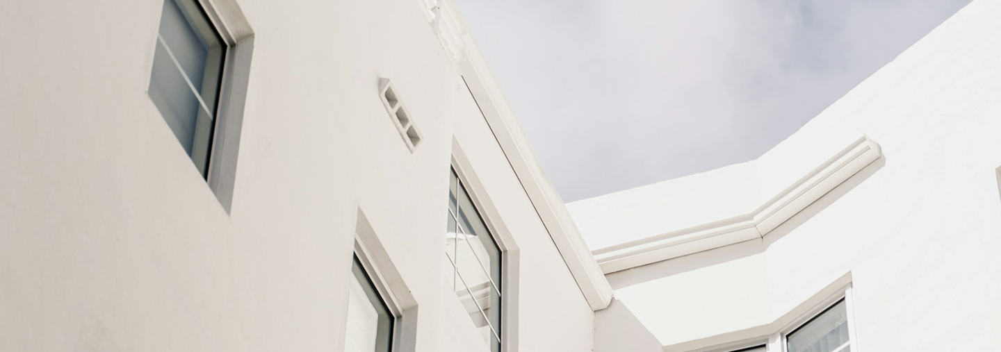 Engineer fixing sink in modern kitchen